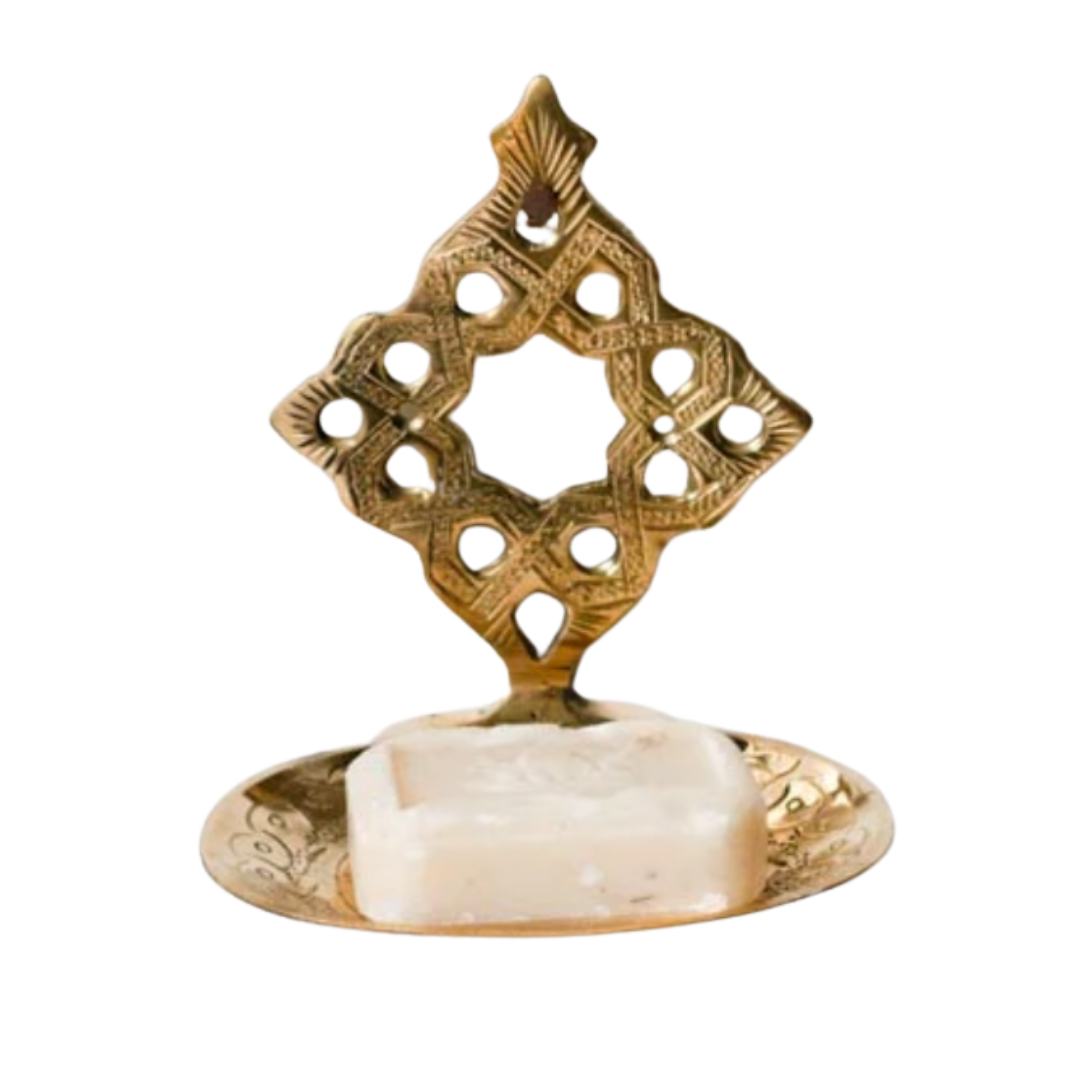 Ornate Moroccan soap dish crafted from hand-etched brass with an upright decorative back and round base.