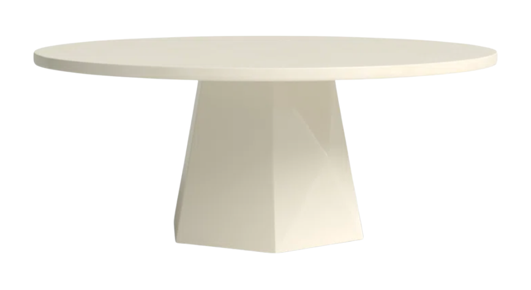 A sculptural round outdoor dining table made of concrete, ideal for hosting meals al fresco.