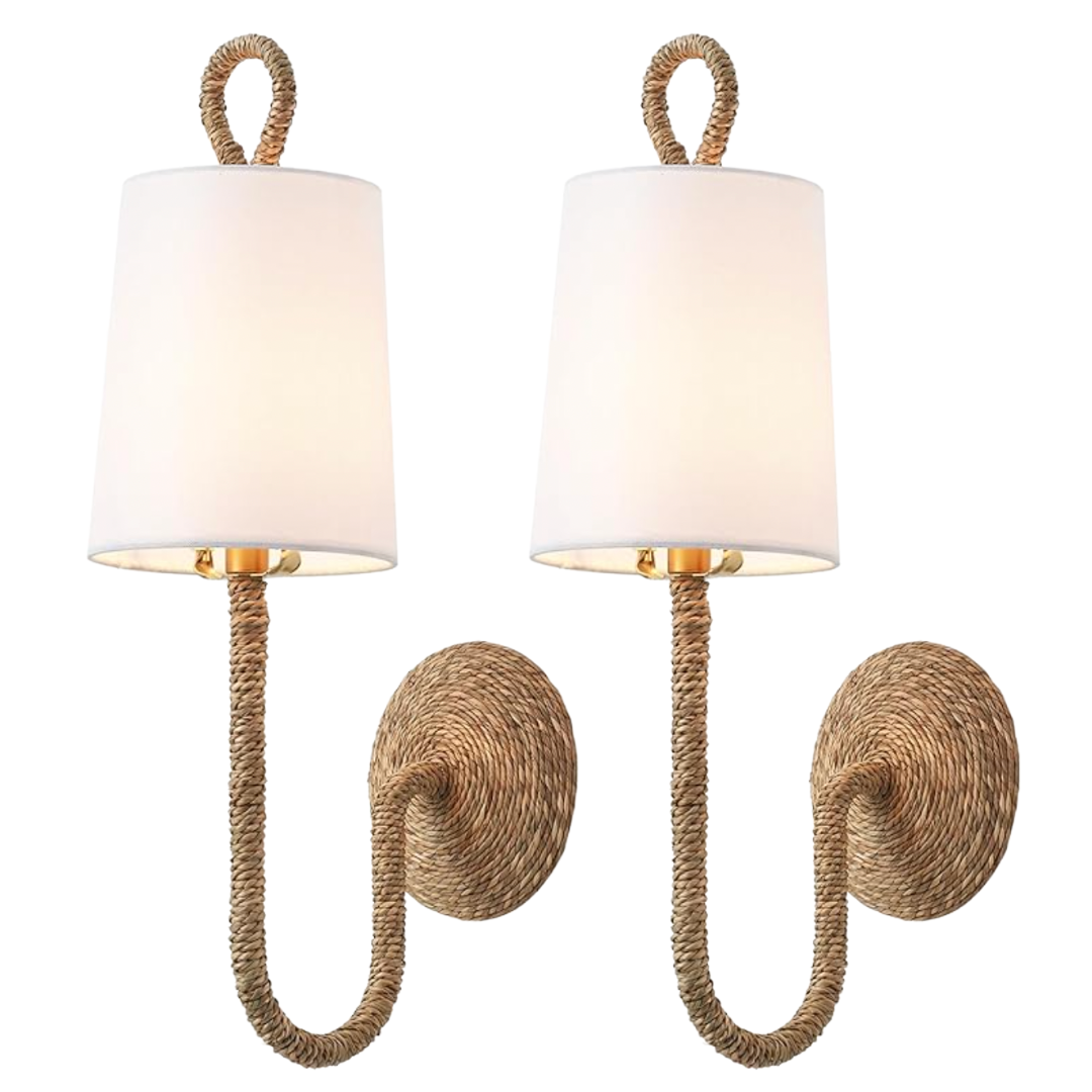 Two coastal-inspired wall sconces with woven rope arms and round backplates, topped with simple white drum shades.