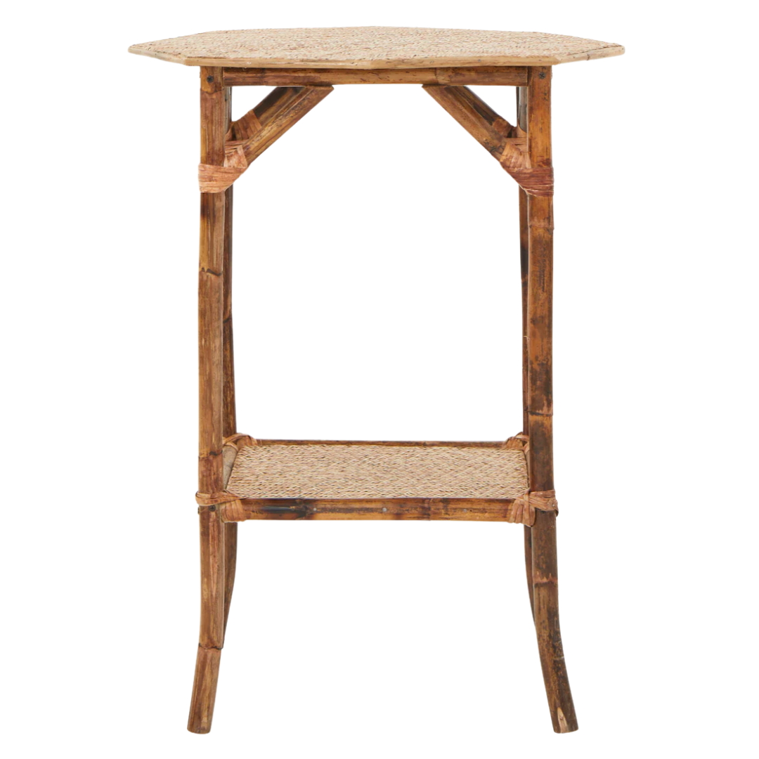 A natural bamboo side table with a square top, lower shelf, and a slightly weathered finish.