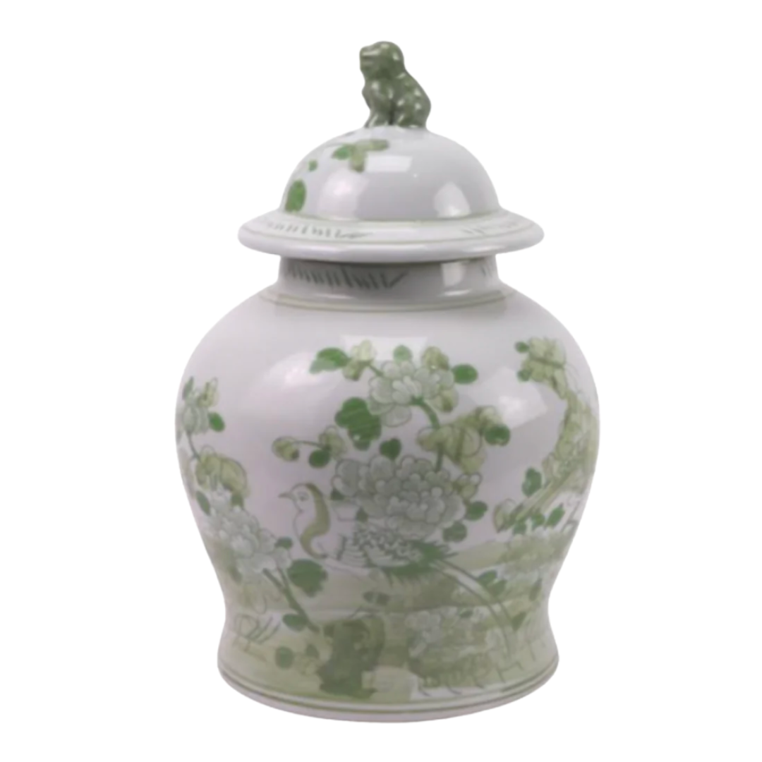 A lidded ceramic jar featuring light green floral and bird motifs on a white base, topped with a lion finial.