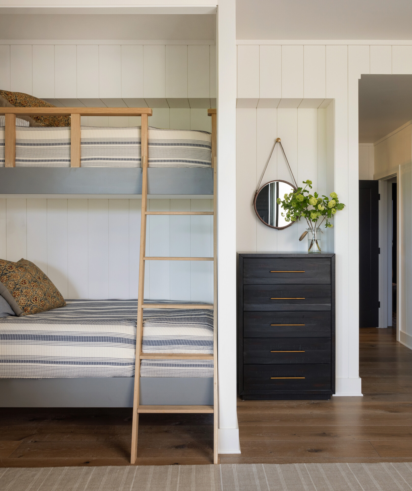 “Close-up view of tongue and groove paneling on a ceiling, painted in a soft white tone for a clean and classic look.”