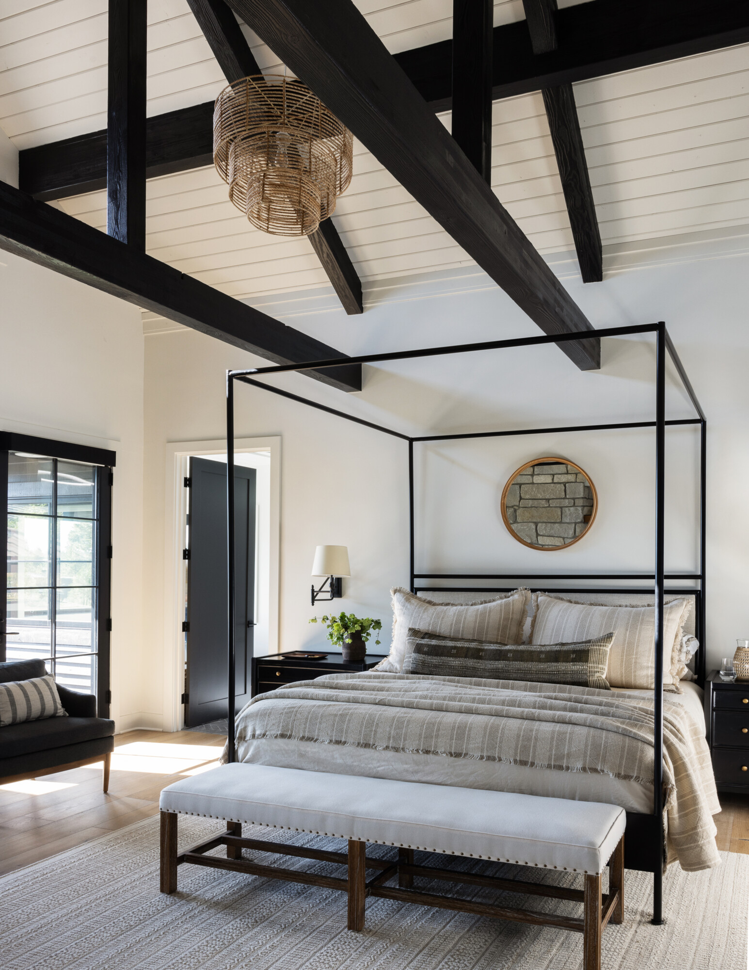 Rustic bedroom with natural wood tongue and groove ceiling, adding warmth and architectural charm.