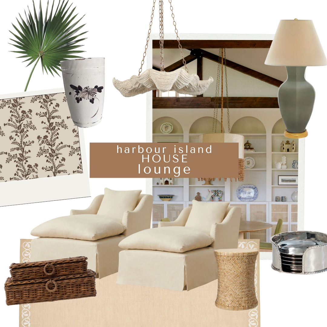 A serene and textural lounge design concept with twin slipcovered chaises, layered wicker baskets, palm fronds, a shell chandelier, black botanical prints, and open built-in shelving styled with pottery and books.