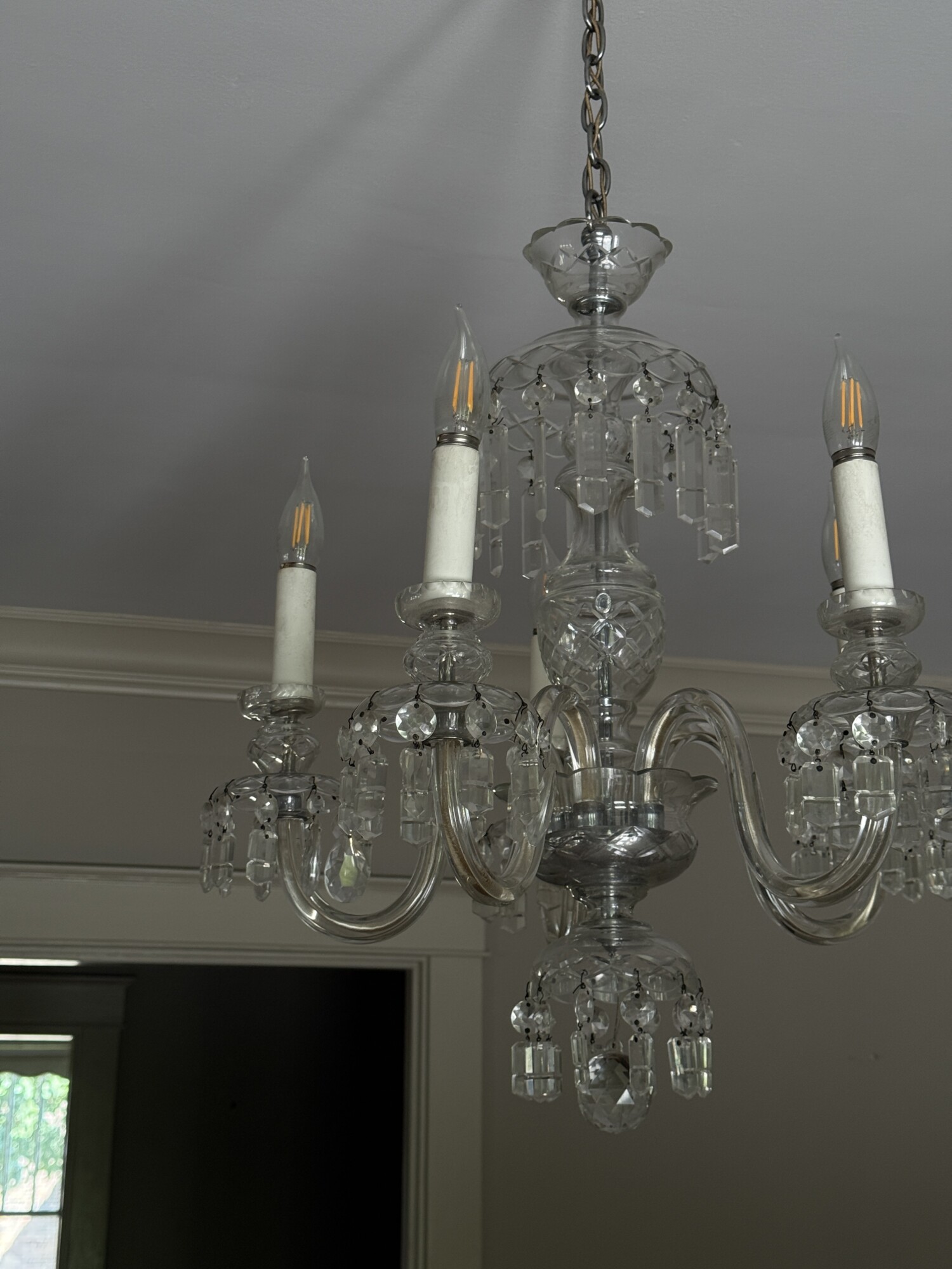 Close-up of vintage glass crystal chandelier with dangling prisms in historic Columbia, Tennessee home.