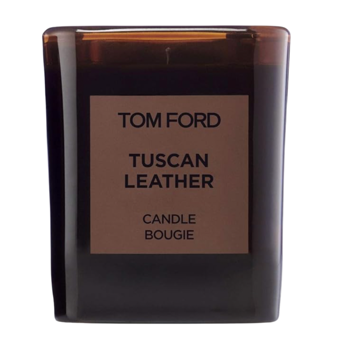 Tom Ford Tuscan Leather candle in dark glass vessel—smoky leather fragrance.