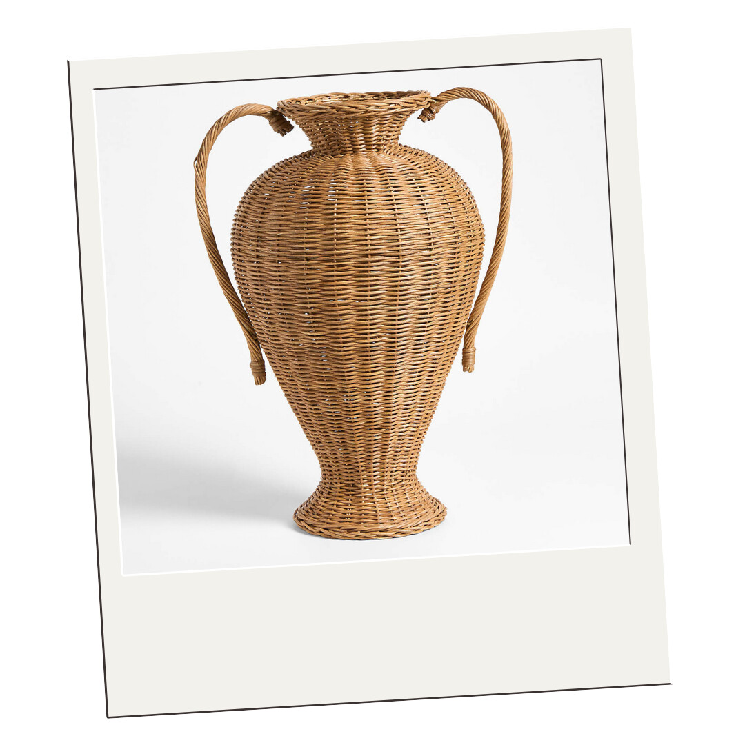 Tall woven wicker vase with sculptural handles, perfect for branches or as a decorative standalone piece.