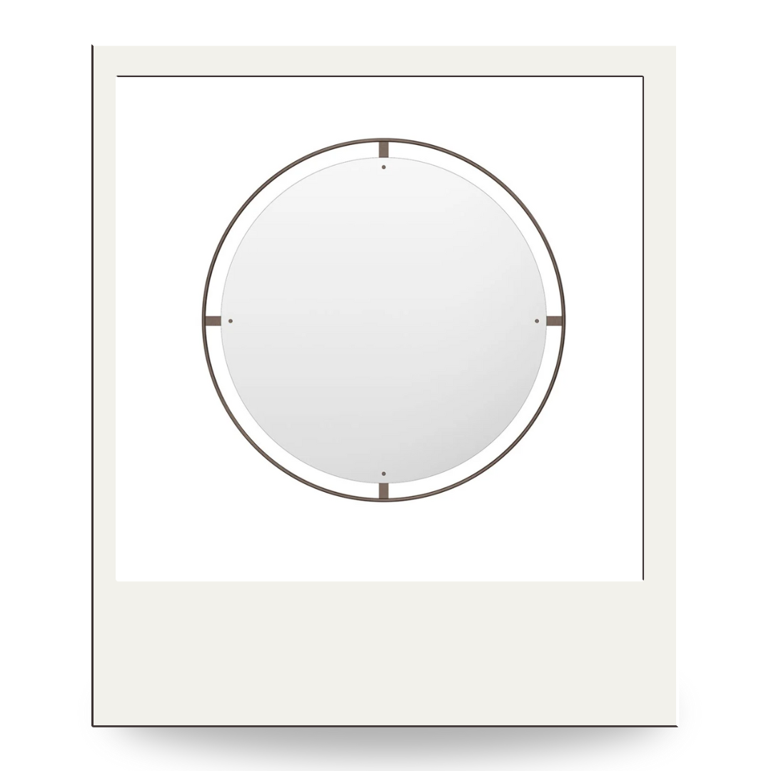 Large round wall mirror with slim bronze frame and four bracket details at the cardinal points; clean, modern.