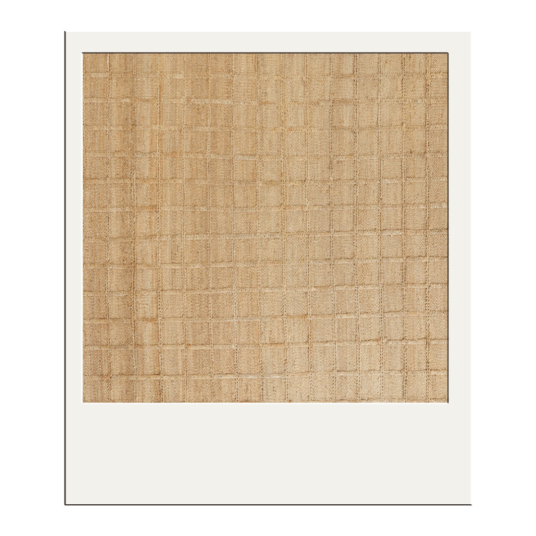 Handwoven natural jute rug with a soft grid texture, timeless foundation piece that adds warmth and grounding to any room.
