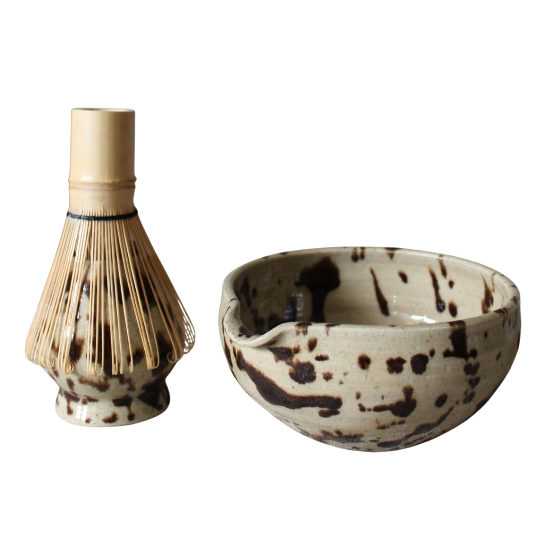 Matcha whisk and ceramic bowl set in earthy tones, perfect for a calm morning ritual or gifting to a tea lover.