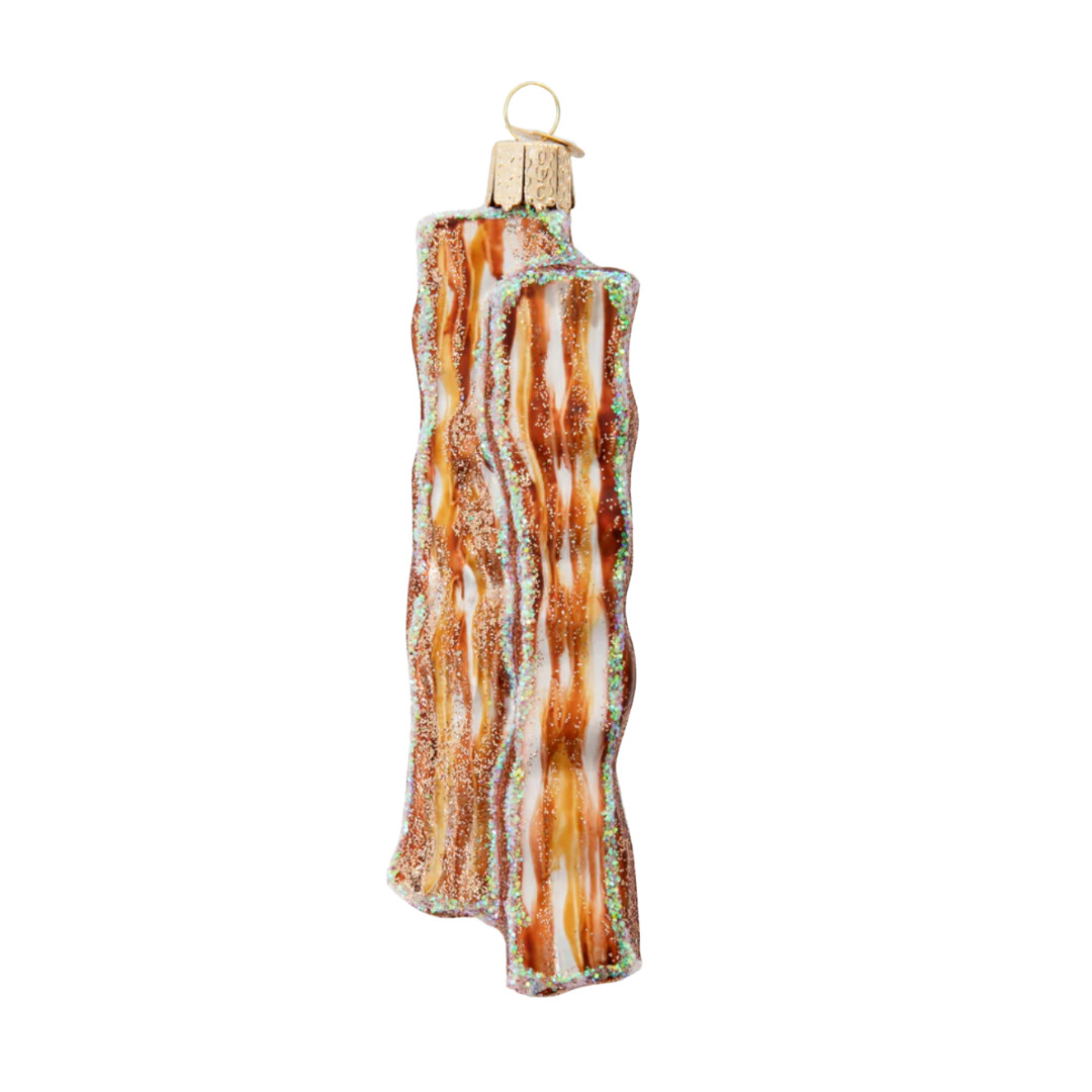Glittering bacon Christmas ornament with iridescent shimmer and golden hook, adding a playful touch to holiday decor.