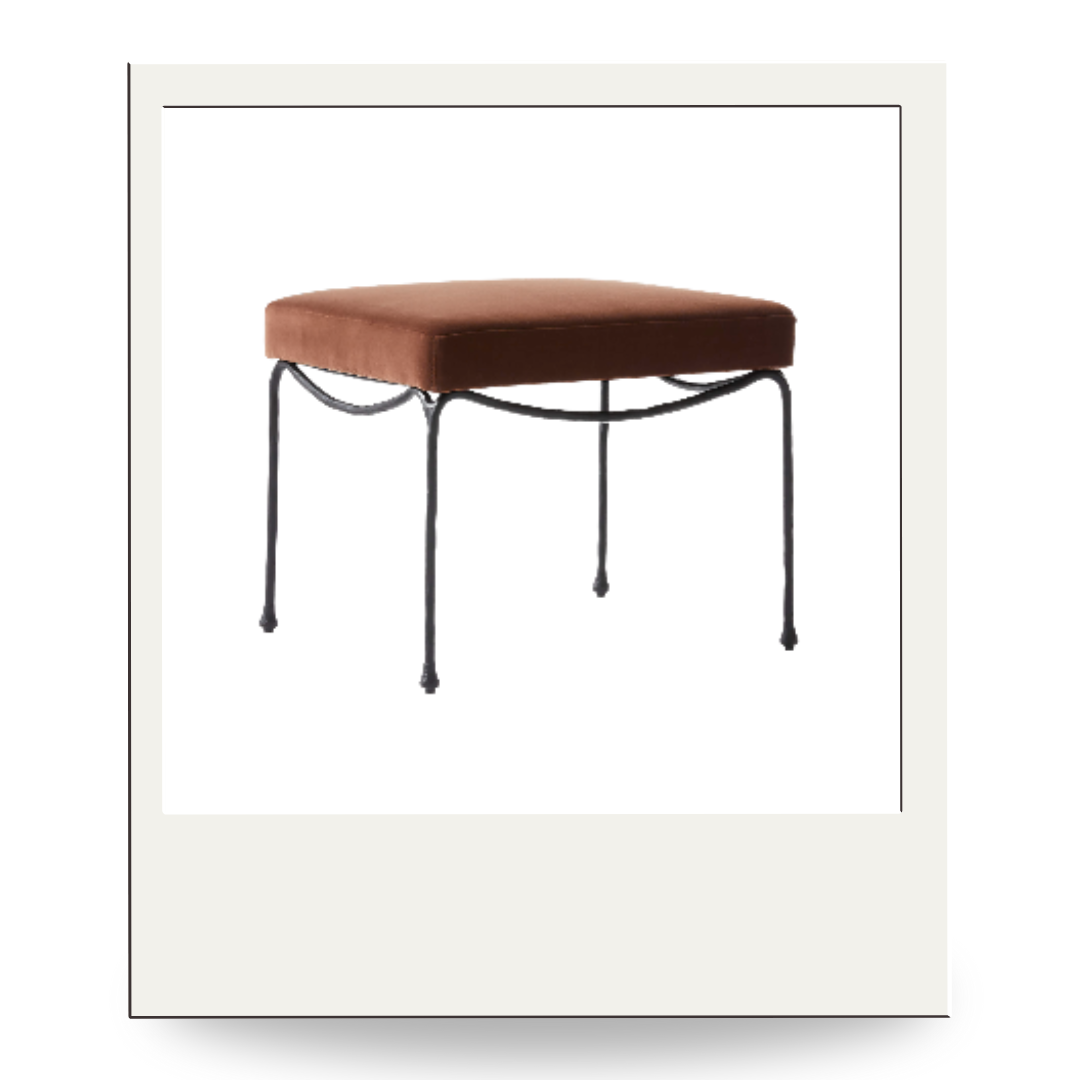 Warm brown velvet stool with slender black iron legs, a versatile accent for seating or under a console.