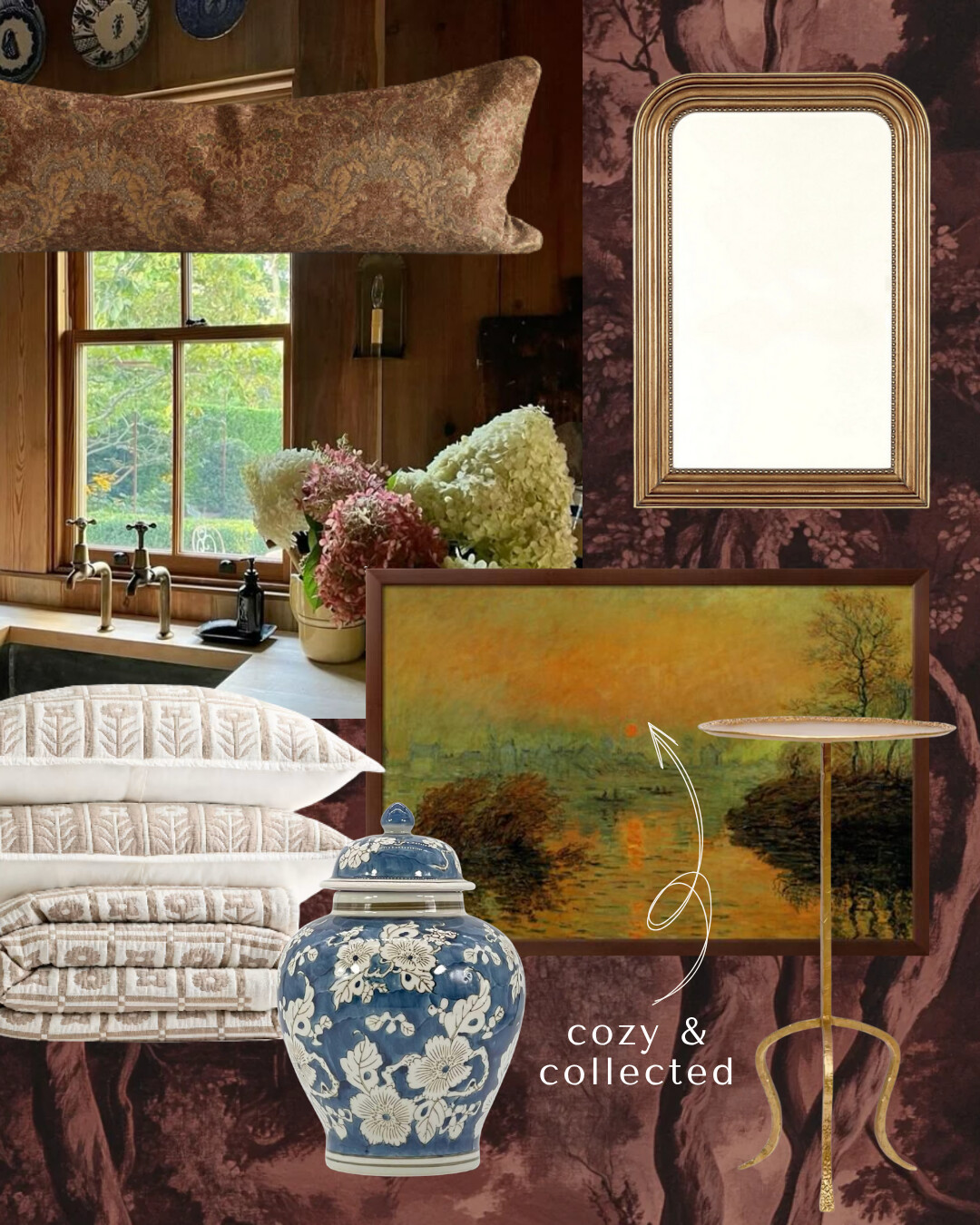 Warm kitchen scene layered with a long brown damask lumbar pillow, arched gold beaded mirror, framed sunset landscape art, cream patterned quilt with matching shams, blue floral ginger jar, and slender brass tripod side table on a moody burgundy toile background. Caption reads ‘cozy & collected.