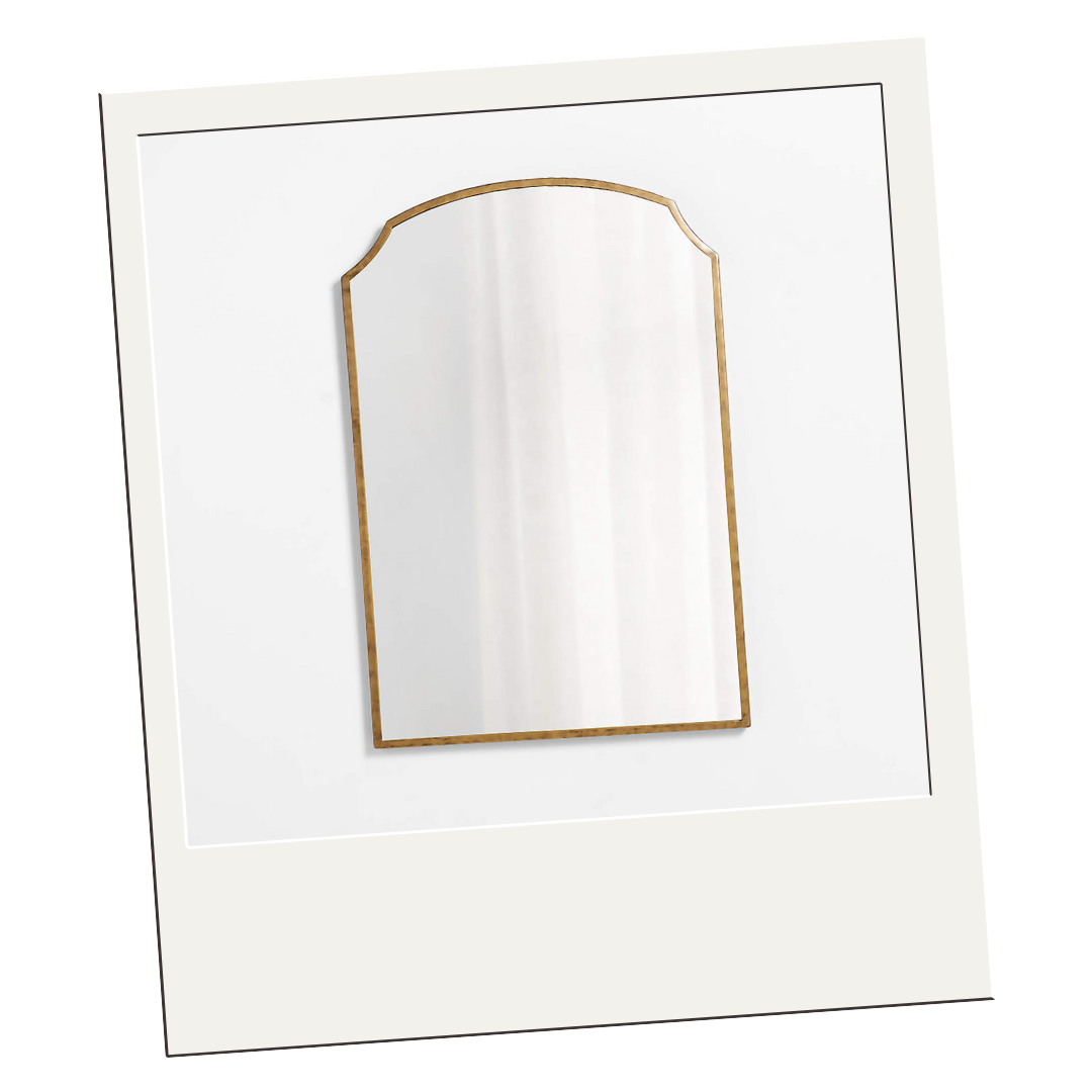 Arched wall mirror with slim gold frame, perfect for layering light and adding classic elegance to a room.