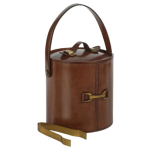 Equestrian-inspired brown leather ice bucket with brass hardware and matching tongs.