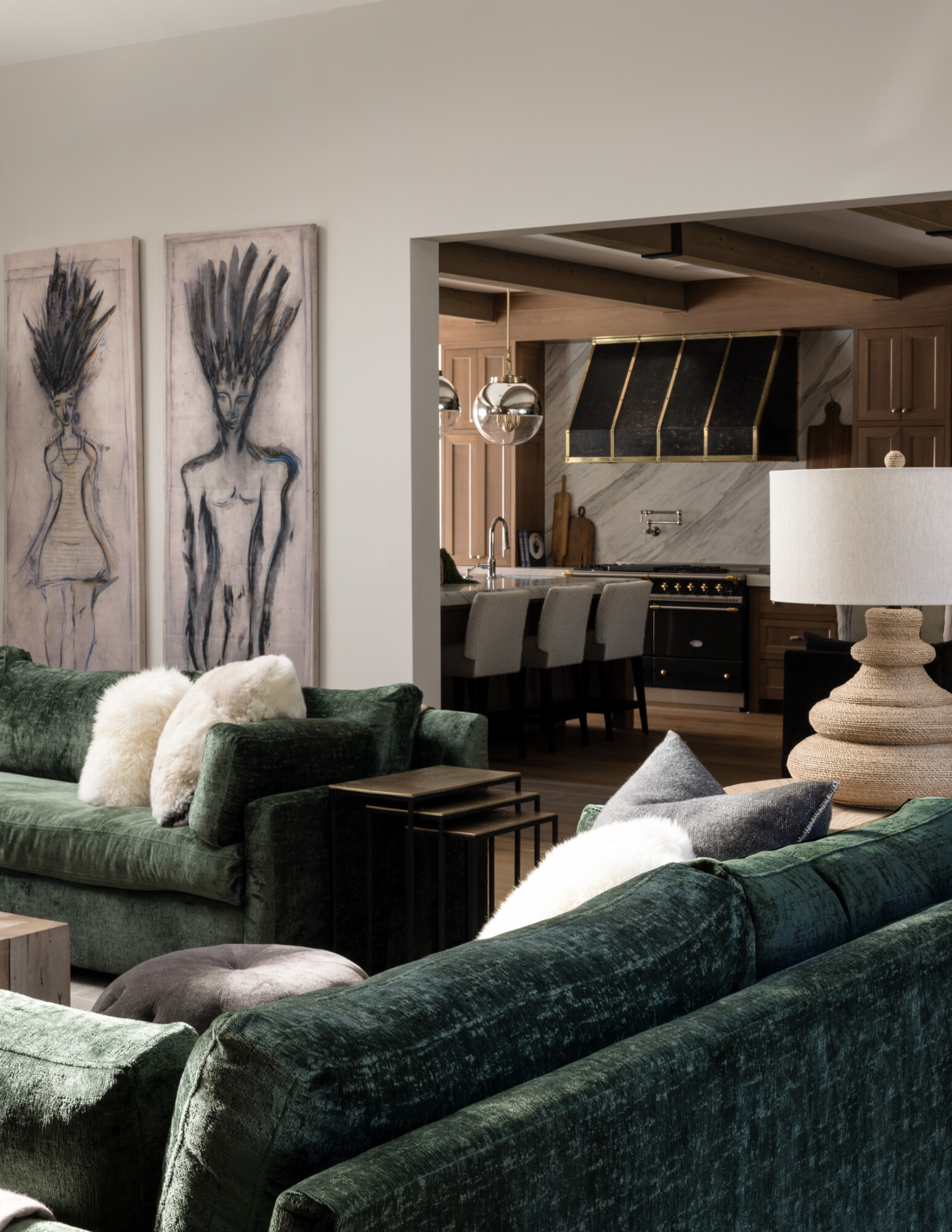 Oh Hey Highlands living room with velvet green sofas and furry throw pillows in a bright white.