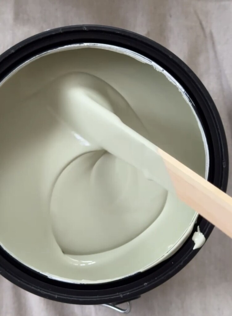 Green paint can - Vert de Terre by Farrow & Ball being stirred